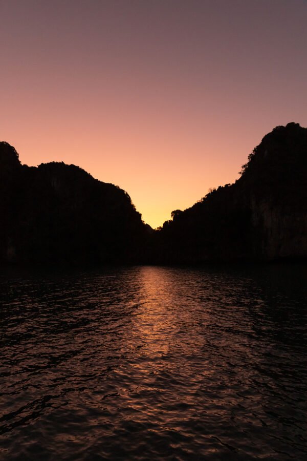 Sunset on Ha long Bay with sea mountains and orange light